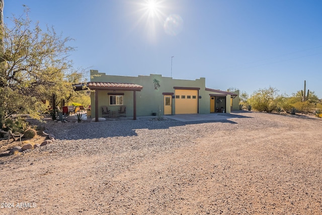 adobe home featuring a garage