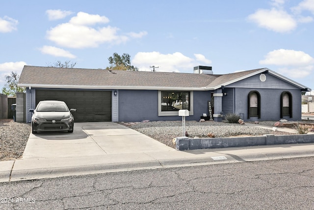 ranch-style home with a garage