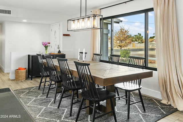 dining room with wood-type flooring