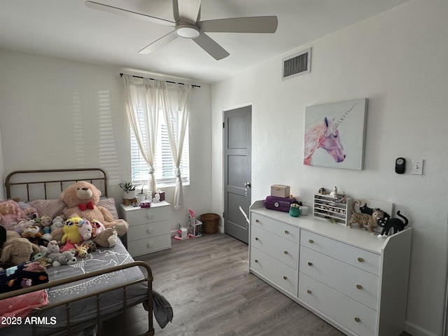 112 W Vogel Ave, Phoenix, AZ 85021 - bedroom with light wood-style floors and ceiling fan