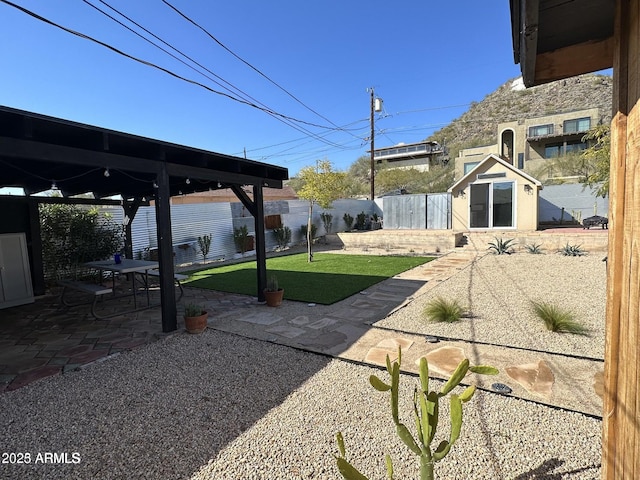 112 W Vogel Ave, Phoenix, AZ 85021 - fenced backyard with an outdoor structure and a patio area