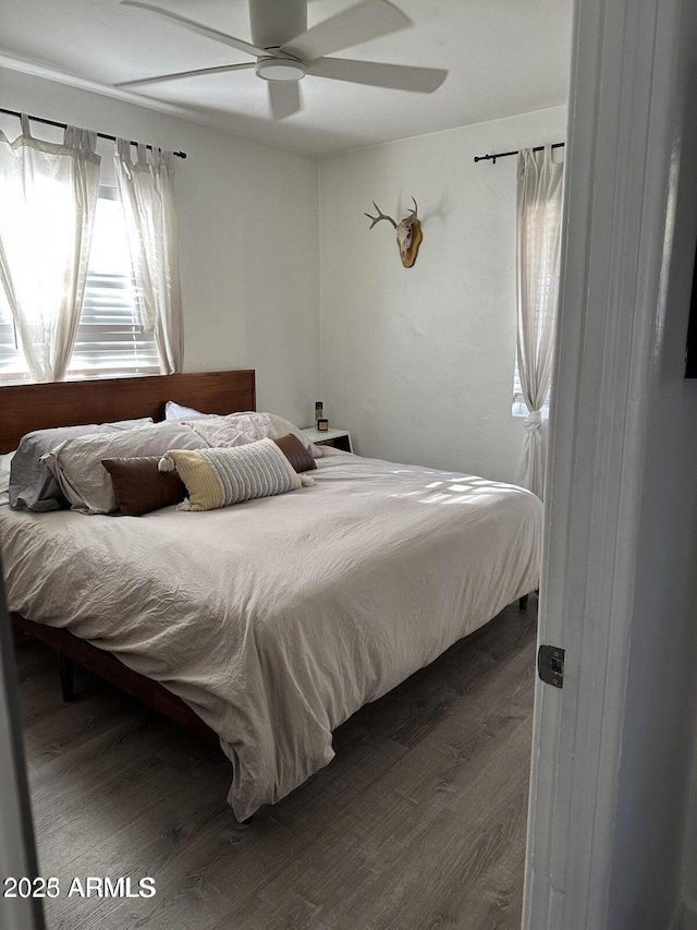 112 W Vogel Ave, Phoenix, AZ 85021 - bedroom with dark wood finished floors and ceiling fan