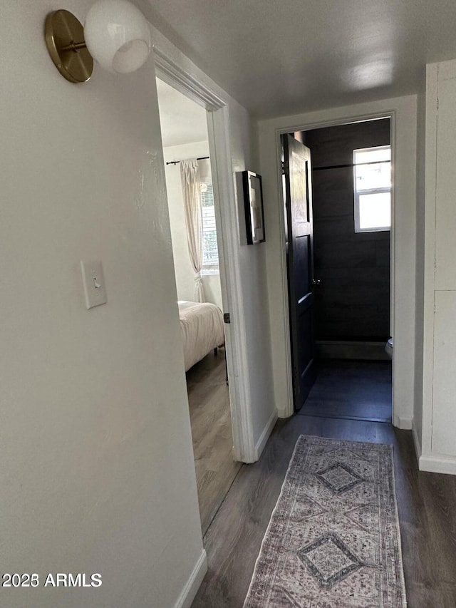 112 W Vogel Ave, Phoenix, AZ 85021 - hallway with baseboards, dark wood-style floors, and plenty of natural light