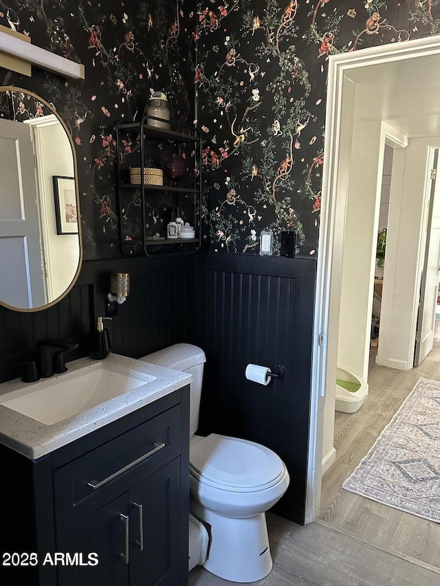 112 W Vogel Ave, Phoenix, AZ 85021 - bathroom featuring wallpapered walls, vanity, toilet, and wood finished floors