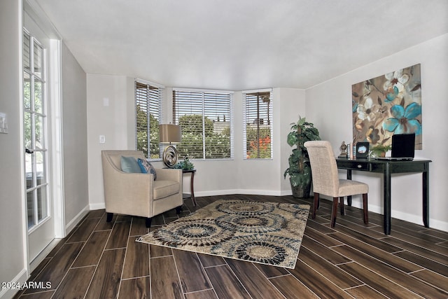 home office with dark wood-type flooring