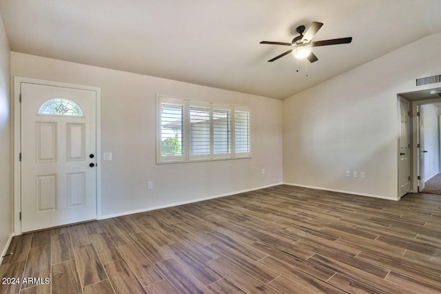 foyer entrance with lofted ceiling, dark wood-type flooring, and ceiling fan