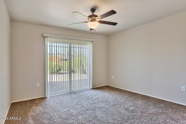 carpeted empty room with ceiling fan and a textured ceiling