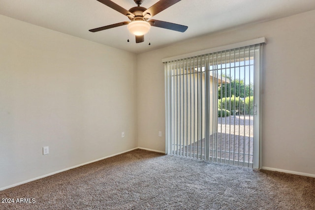 spare room featuring carpet floors and ceiling fan