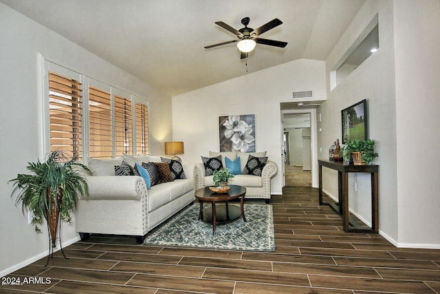 living room with lofted ceiling, dark hardwood / wood-style floors, and ceiling fan