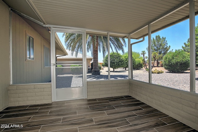 unfurnished sunroom featuring plenty of natural light