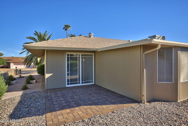 rear view of property featuring a patio