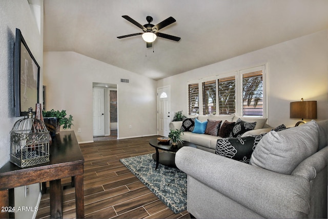 living room with dark wood-type flooring, ceiling fan, and lofted ceiling