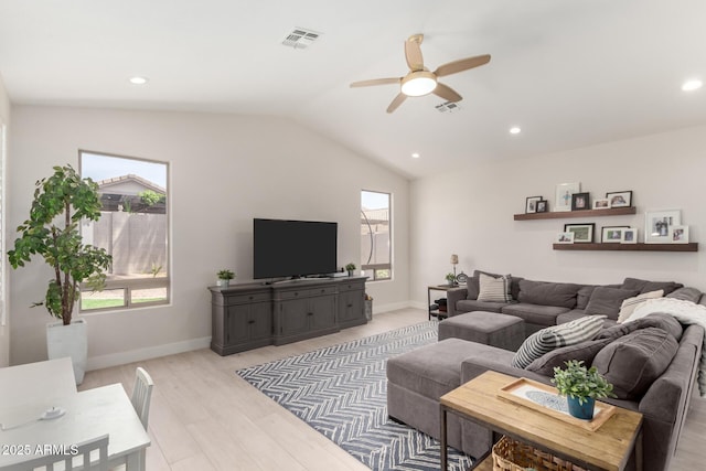 living room featuring a ceiling fan, lofted ceiling, light wood-style flooring, recessed lighting, and baseboards
