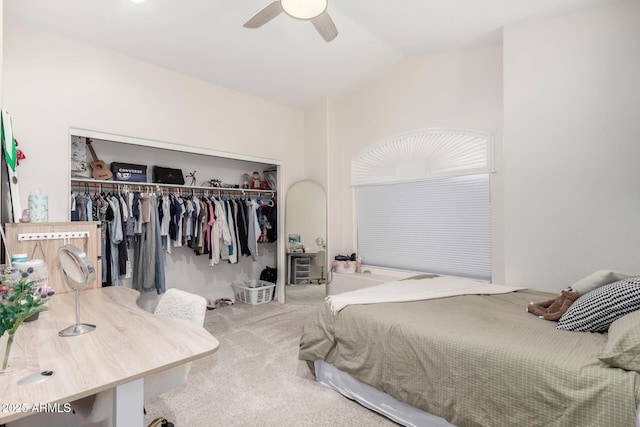 carpeted bedroom featuring vaulted ceiling, a closet, and ceiling fan