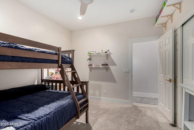 carpeted bedroom featuring baseboards