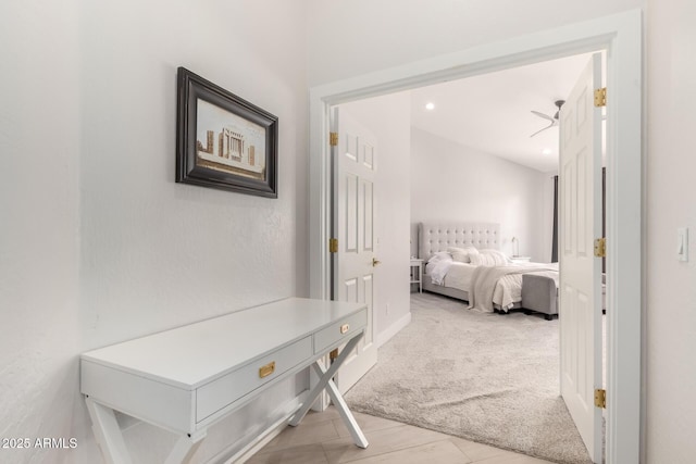 hallway with carpet, baseboards, and recessed lighting