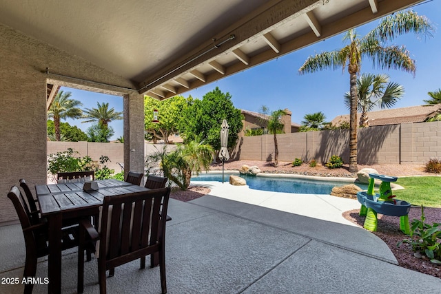 view of patio / terrace with a fenced backyard and outdoor dining area