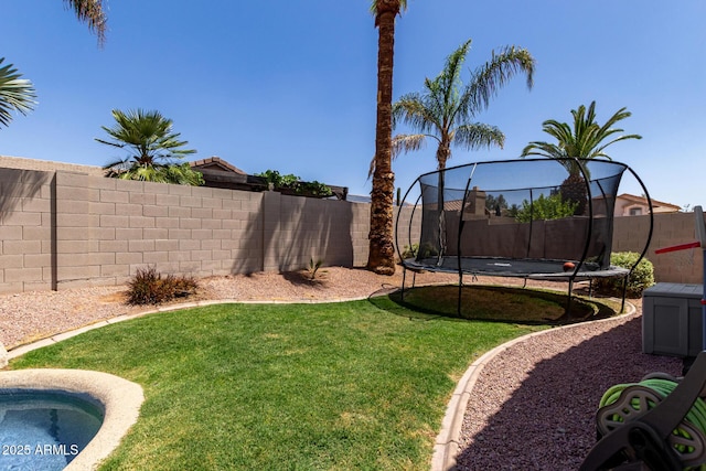 view of yard with a trampoline