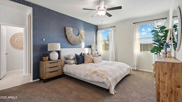 bedroom featuring baseboards, carpet flooring, and wallpapered walls