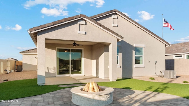 back of house featuring a patio, stucco siding, central AC, fence, and ceiling fan