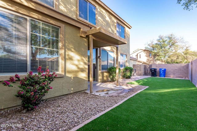 view of yard featuring a fenced backyard and a patio area
