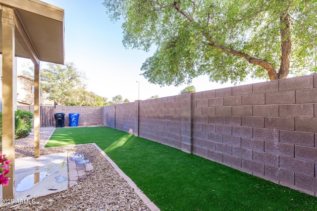 view of yard with a fenced backyard