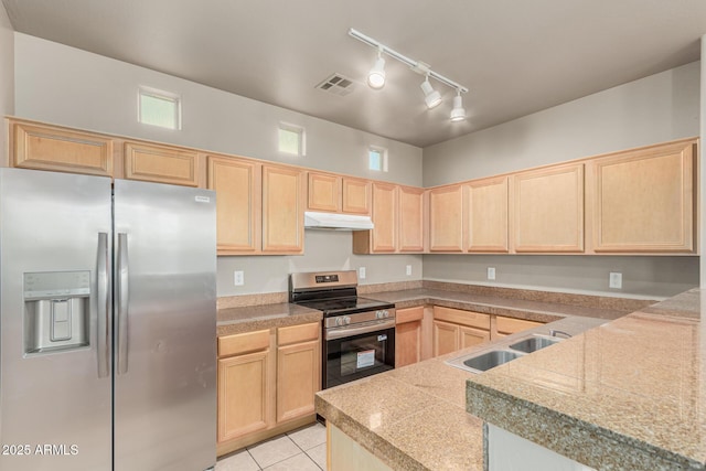 kitchen with tile countertops, appliances with stainless steel finishes, under cabinet range hood, and light brown cabinets