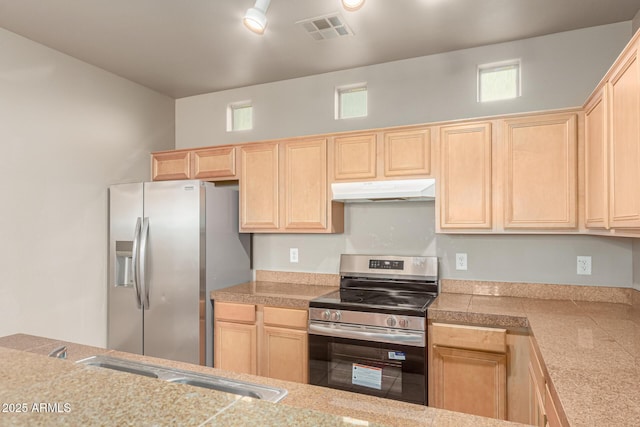 kitchen with visible vents, under cabinet range hood, light brown cabinetry, and stainless steel appliances