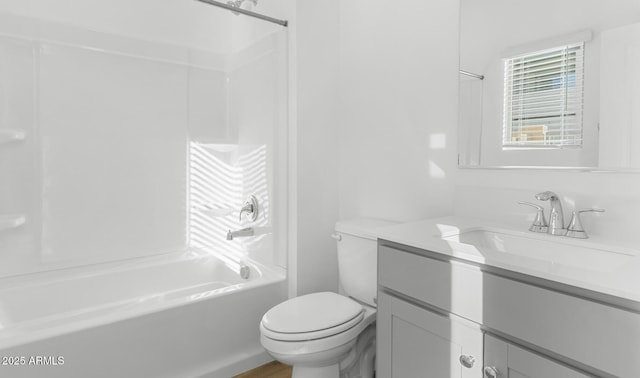 bathroom with toilet, bathtub / shower combination, and vanity