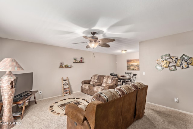 living room with light colored carpet and ceiling fan