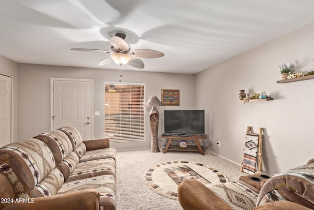 carpeted living room featuring ceiling fan