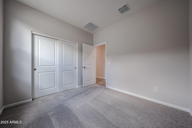 2514 E Music Mountain Ave, Apache Junction, AZ 85119 - unfurnished bedroom with carpet, baseboards, and a closet