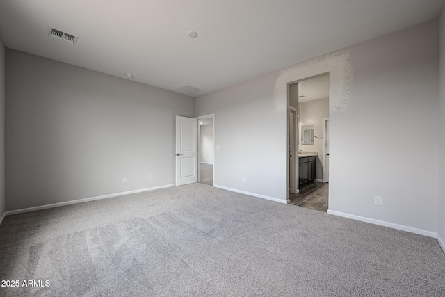 2514 E Music Mountain Ave, Apache Junction, AZ 85119 - unfurnished bedroom featuring carpet, baseboards, and ensuite bathroom