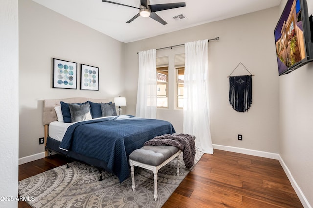 bedroom featuring ceiling fan and dark hardwood / wood-style flooring