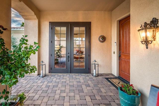 property entrance featuring french doors