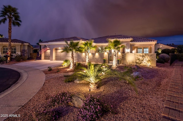 mediterranean / spanish-style house featuring a garage