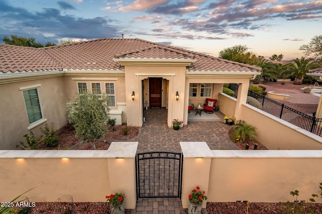 mediterranean / spanish house featuring a patio