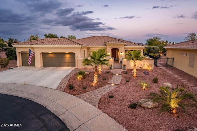 mediterranean / spanish-style home featuring a garage