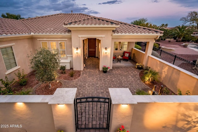 view of front facade with a patio area