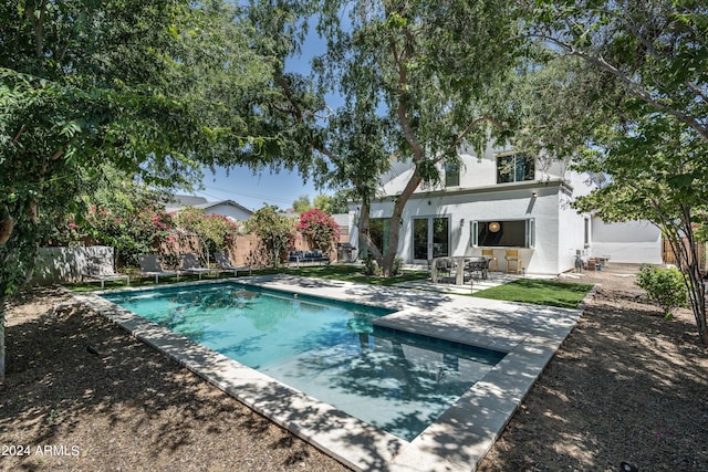 view of pool featuring a fenced in pool, fence, and a patio area