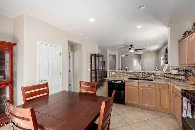 kitchen with black appliances, sink, decorative backsplash, ceiling fan, and kitchen peninsula