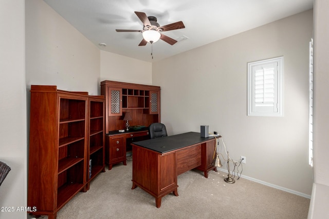 office area featuring ceiling fan and light carpet