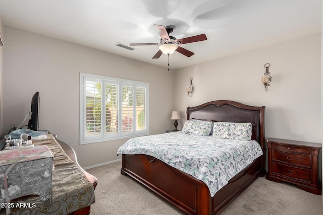 bedroom featuring light carpet and ceiling fan