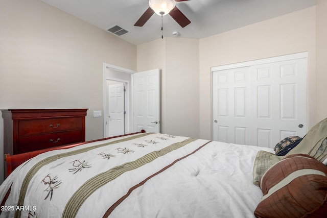 bedroom with ceiling fan and a closet