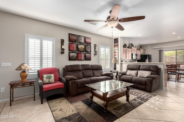 tiled living room featuring ceiling fan