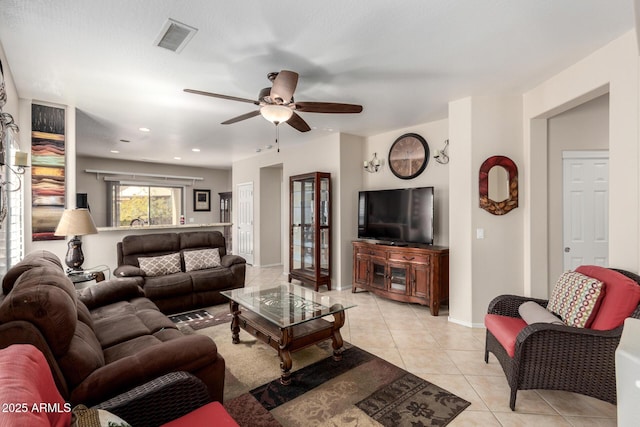 tiled living room featuring ceiling fan