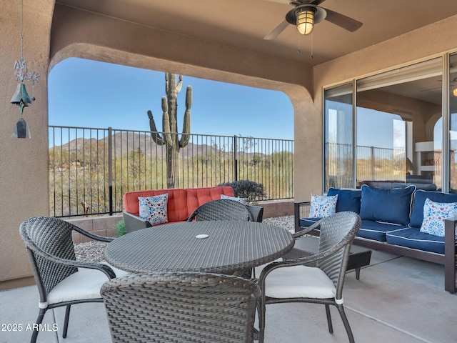 view of patio / terrace with ceiling fan, outdoor lounge area, and fence