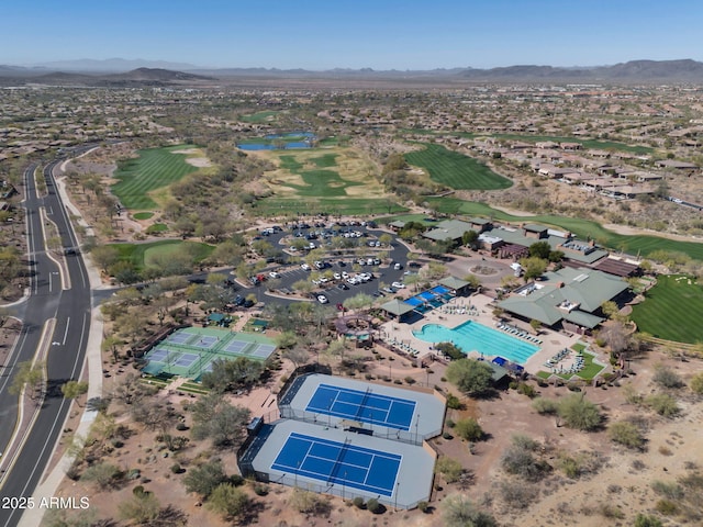 birds eye view of property with a mountain view