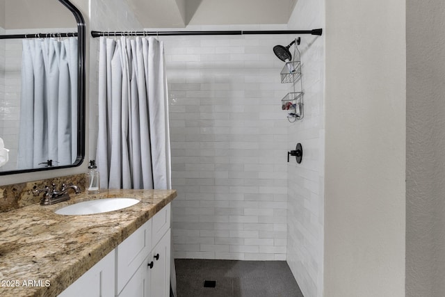 bathroom featuring vanity and a shower with shower curtain