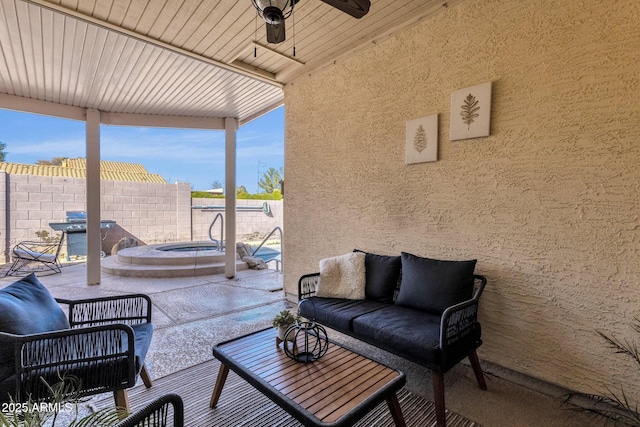 view of patio / terrace featuring area for grilling, an outdoor hangout area, ceiling fan, and an in ground hot tub